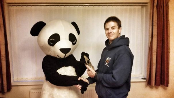 Robey the Panda receives CRC "Spirit of the Club" award from Mike Wells