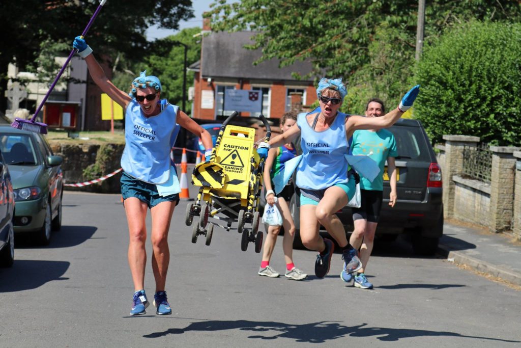 The ever efficient ladies of the sweeping team, leaping their way along the Sting course